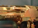 Magnum Research Desert Eagle 50AE,in the rare bright Titanium gold,6", a real showpiece hand cannon,never fired,in case with all papers & DVD,MK
- 5 of 15