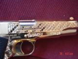 Colt Government 1911,45acp,fully 24K Gold plated ,Master engraved in fish scale design,2 mags,never fired,box,manual etc,awesome 1 of a kind showpiece - 2 of 15