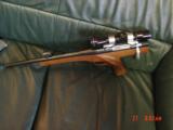 Wichita Silhouette pistol 15" barrel;,308 Win.,walnut stock,thumbrest,Leupold scope & rear peephole site,hair trigger,like new,& very rare indeed - 2 of 15