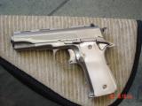 Llama 380,3 1/2",refinished bright nickel,as new now,leather holster,bonded ivory grips,mini 1911,R1,made circa 1973,a real showpiece pocket gun
- 15 of 15