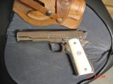 Colt 45 ACP,made for Argentine Military,around 1950,fully refinished bright nickel,real Water Buffalo bone grips,same as model 1927,carved holster
- 13 of 15