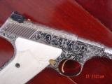 Colt Woodsman 1950 ?,fully deep master engraved & nickel plated,by Bob Valade,real ivory grips,6" 22lr,gold accents,a work of art-nicer in person - 2 of 15