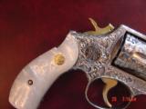 Smith & Wesson,model 10,Fully engraved by Flannery Engraving,& refinished in bright nickel w/24k accents,2" barrel,Pearlite grips,leather case,38 - 5 of 15