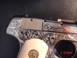 Colt 1903,32Cal,master engraved & refinished nickel by S.Leis,1923,bonded ivory grips,blue accents.a work of art !! - 13 of 15