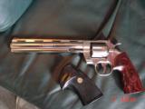 Colt Python 8" bright nickel 1980, custom Rosewood grips & original grips, 37 years old, looks great,357 Magnum,heavy vented rib,smooth action
- 6 of 15