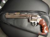Colt Python 8" bright nickel 1980, custom Rosewood grips & original grips, 37 years old, looks great,357 Magnum,heavy vented rib,smooth action
- 9 of 15