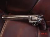 Colt Python 8" bright nickel 1980, custom Rosewood grips & original grips, 37 years old, looks great,357 Magnum,heavy vented rib,smooth action
- 13 of 15