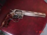 Colt Python 8" bright nickel 1980, custom Rosewood grips & original grips, 37 years old, looks great,357 Magnum,heavy vented rib,smooth action
- 1 of 15