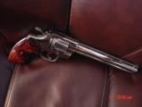 Colt Python 8" bright nickel 1980, custom Rosewood grips & original grips, 37 years old, looks great,357 Magnum,heavy vented rib,smooth action
- 12 of 15
