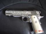 Colt Gold Cup Trophy 45,fully deep hand engraved & polished by Flannery Engraving,real Giraffe grips,2 mags,box,manual etc.a true masterpiece,awesome
- 15 of 15