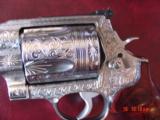 Smith & Wesson 500,4",fully engraved & polished by Flannery Engraving,Rosewood grips,2 comps,box & certificate,1 of a kind hand cannon ! awesome
- 6 of 15