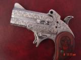 Bond Arms 410/45LC,fully engraved & polished by Flannery Engraving,2 shots,rosewood grips,nib,awesome work of art hand cannon
!! - 1 of 15
