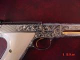 Colt Woodsman Match Target,master engraved by Brian Mears,nickel with 24K accents,real ivory grips,1957,22LR,6",awesome work of art.60 years old
- 4 of 15
