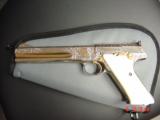 Colt Woodsman Match Target,master engraved by Brian Mears,nickel with 24K accents,real ivory grips,1957,22LR,6",awesome work of art.60 years old
- 2 of 15
