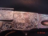 Colt Woodsman Match Target,master engraved by Brian Mears,nickel with 24K accents,real ivory grips,1957,22LR,6",awesome work of art.60 years old
- 13 of 15
