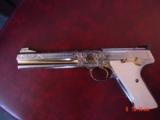 Colt Woodsman Match Target,master engraved by Brian Mears,nickel with 24K accents,real ivory grips,1957,22LR,6",awesome work of art.60 years old
- 1 of 15