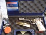 Colt Government 1911,Series 80,just fully refinished in bright nickel,& 24k gold accents,2 mags,Pearlite grips,never fired,box,manual,etc.awesome gun
- 7 of 12