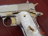 Colt Government 1911,Series 80,just fully refinished in bright nickel,& 24k gold accents,2 mags,Pearlite grips,never fired,box,manual,etc.awesome gun
- 5 of 12