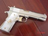 Colt Government 1911,Series 80,just fully refinished in bright nickel,& 24k gold accents,2 mags,Pearlite grips,never fired,box,manual,etc.awesome gun
- 1 of 12