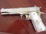 Colt Government 1911,Series 80,just fully refinished in bright nickel,& 24k gold accents,2 mags,Pearlite grips,never fired,box,manual,etc.awesome gun
- 4 of 12