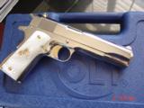 Colt Government 1911,Series 80,just fully refinished in bright nickel,& 24k gold accents,2 mags,Pearlite grips,never fired,box,manual,etc.awesome gun
- 8 of 12