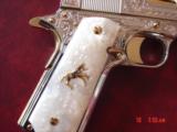 Colt 1911, 45,master engraved by Santiago Leis,refinished in bright nickel & 24K gold accents,Pearlite grips,case,manual etc. never fired,awesome gun
- 5 of 15