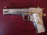 Colt 1911, 45,master engraved by Santiago Leis,refinished in bright nickel & 24K gold accents,Pearlite grips,case,manual etc. never fired,awesome gun
- 1 of 15