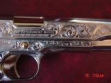 Colt 1911, 45,master engraved by Santiago Leis,refinished in bright nickel & 24K gold accents,Pearlite grips,case,manual etc. never fired,awesome gun
- 3 of 15