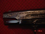 Colt 1903,32Cal,Hammerless,circa 1921,fully refinished bright blue & master engraved by S.Leis,certificate,bonded ivory grips,& way nicer in person.!! - 4 of 15