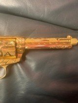 Colt SAA 1906, 1st Gen.,fully master engraved by Flannery,24k plated in rare Cattle
Brand real ivory grips, 32WCF/32-20, 5 1/2"- - 3 of 7