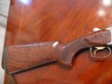 Browing 725 12ga , adjustable comb, 32" ported barrels and extended chokes, sporting rib - 2 of 13