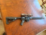 Aero Precision M4 rifle in 300 Blackout and a SIG 1-8X optic - 1 of 5