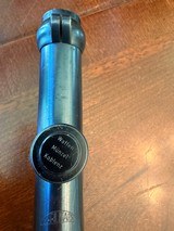 Karl Kaps 2 1/2 power German hunting scope with claw mounts and their bases as modified for an 11 mm rail.