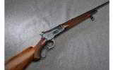 Winchester Model 71 Deluxe Lever Action Rifle in .348 WCF - 1 of 9