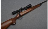 Remington Model 700 Bolt Action Rifle in .30-06 Sprg. with Redfield Scope - 1 of 9