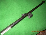 Remington 1100 slug barrel, 12ga 2 3/4" chamber, rifle sights, fiberoptic, fixed cylinder choke, 22 inches in length. - 1 of 4