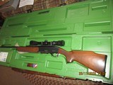 Remington 7400 in 243 Winchester- scoped and green factory case - 1 of 9