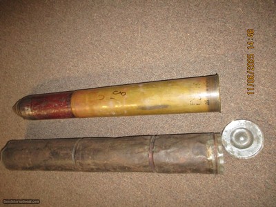 75 mm artillary round complete with outer tin protective/ shipping case dated 1918 (empty and fuze dissassembled)