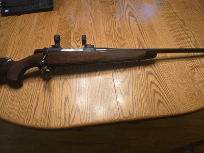 Browning A-Bolt Medallion Boss engraved 7mm Rem
w 30mm rings