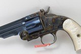 Uberti Schofield by Taylor, 45 Long Colt, 7 inch bbl, Charcoal Blue/case hardened Finish, Factory Im. Pearl Grips, factory box and case. - 2 of 5
