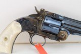 Uberti Schofield by Taylor, 45 Long Colt, 7 inch bbl, Charcoal Blue/case hardened Finish, Factory Im. Pearl Grips, factory box and case. - 3 of 5