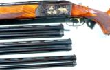 KRIEGHOFF MODEL 32 CROWN GRADE .12 GAUGE 28” SKEET GUN W/ EXTRA 20, 28, AND .410 GAUGE 28” BARRELS CIRCA 1970’S. - 1 of 8