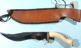 EXCEPTIONAL LARGE OLSON YATAGAN BOWIE KNIFE AND SHEATH CIRCA 1970’S.
- 6 of 7
