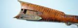 FINE TENNESSEE BRASS MOUNTED TIGER MAPLE PERCUSSION MULE EAR LONGRIFLE CIRCA 1840’S.
- 9 of 14