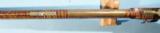 FINE TENNESSEE BRASS MOUNTED TIGER MAPLE PERCUSSION MULE EAR LONGRIFLE CIRCA 1840’S.
- 14 of 14