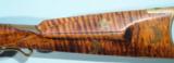 FINE TENNESSEE BRASS MOUNTED TIGER MAPLE PERCUSSION MULE EAR LONGRIFLE CIRCA 1840’S.
- 5 of 14