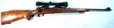 PRE-'64 WINCHESTER MODEL 70 FW FEATHERWEIGHT .308WIN BOLT ACTION RIFLE WITH SCOPE, CIRCA 1953.
- 1 of 9
