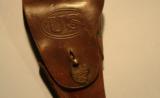 WWI U.S. MODEL 1916 FLAP HOLSTER FOR 1911 PISTOL WITH ARMY INFANTRY COLLAR DISC ON FLAP.
- 1 of 4