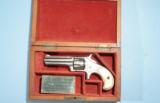 CASED RARE MINT FACTORY ENGRAVED REMINGTON SMOOT’S PATENT 1ST MODEL .30 RF CAL. REVOLVER CA. 1875.
- 1 of 11