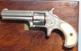 CASED RARE MINT FACTORY ENGRAVED REMINGTON SMOOT’S PATENT 1ST MODEL .30 RF CAL. REVOLVER CA. 1875.
- 5 of 11